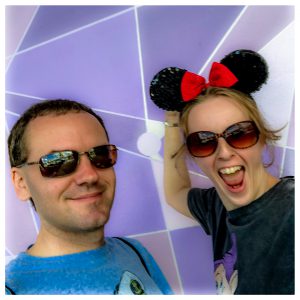 Alistair & Fiona standing in front of the Purple Wall.