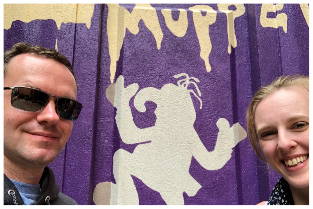 Alistair & Fiona standing in front of the Muppets Wall at Disney's Hollywood Studios